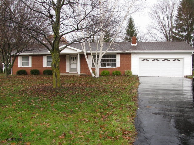 Brick & vinyl ranch in exceptional neighborhood. Quality built home with plaster walls and hardwood floors thru-out! This home offers a living room w/ stone wood burning fireplace, DR., EIK w/new flooring, 3 bedrooms all with cedar lined closets and 2 newly remodeled baths! Roof,siding,and gutters all new in 2011. Partially finished basement with 2nd fireplace! Screened porch and attached 2 car garage complete this picture perfect home!