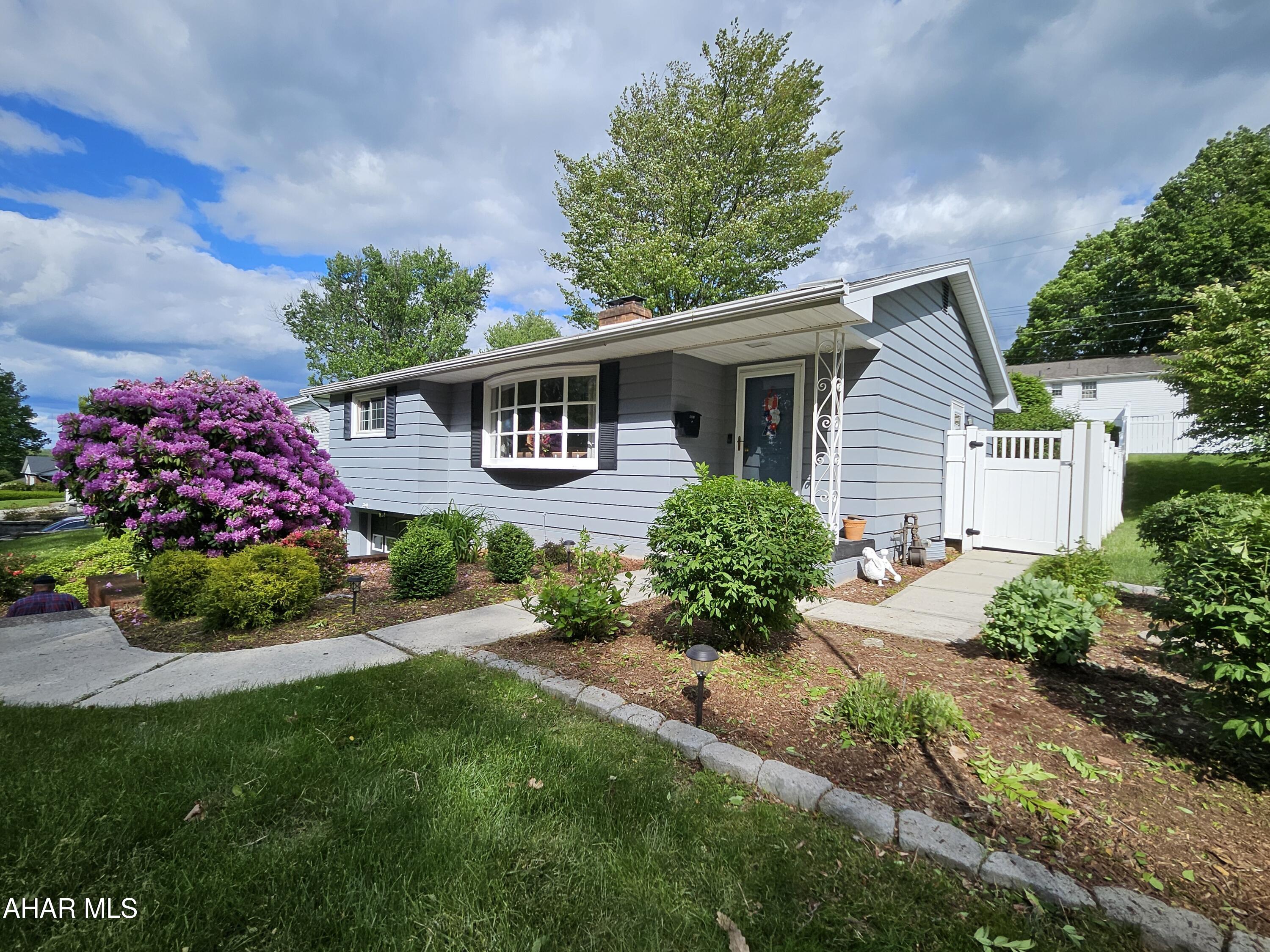 Step into this beautifully updated 1960 raised ranch.  This one time owner home boasts 3 spacious bedrooms and 2.5 baths, this home offers comfort, style, and functionality throughout. The master bedroom includes its own private half bath.
The heart of the home is a large living room that is flooded with natural light from the oversized bay window that overlooks the woods and extensive landscaping.  Enjoy cozy evenings in the expansive living room, featuring a unique two-sided fireplace that adds ambiance and charm to both the living and dining spaces.  The kitchen is trimmed in cherry and granite kitchen.  There are hardwood floors throughout the home under the carpet.

The finished basement extends your living area, ideal for a family room and home office, or guest space.  There is a large bath with plenty of storage in the lower level that adjoins the well thought out laundry space.  There is no shortage of storage throughout the home.  Garage has the capacity to hold 2 vehicles.

Step outside to a deck and fully fenced yard offering both beauty and privacy. Whether you're hosting gatherings, gardening, or just relaxing, the outdoor space is as inviting as the interior.

This turn-key home blends the solid construction of the 1960s with all the updates and conveniences of today — a true gem ready to be enjoyed.