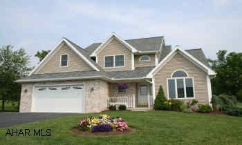 Striking 2-story contemporary located in upscale neighborhood w/fantastic views of the mountains from the large multi-tier cedar deck. Dramatic foyer, oak custom kitchen, breakfast nook, light and airy ambiance.  Decorator touches; ceiling fans; chandeliers, recessed lighting. Basement level has large family room. Professional landscaping, garden shed, large yard. Home has 2 full and 2 half baths. Basement has cedar closet, storage room