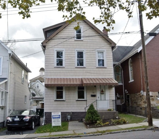 Immaculately kept 2-1/2 story in beautiful Hollidaysburg borough.  Move-in ready, with updated kitchen, bath, and central air.  Newer roof.  Features off-street parking - a driveway plus a carport!  Cute fenced yard and covered back porch, within walking distance to schools, the Historic Hollidaysburg Diamond, Hollidaysburg Library, and YMCA!  Check out this charming home in a prime location!  It won't last long!