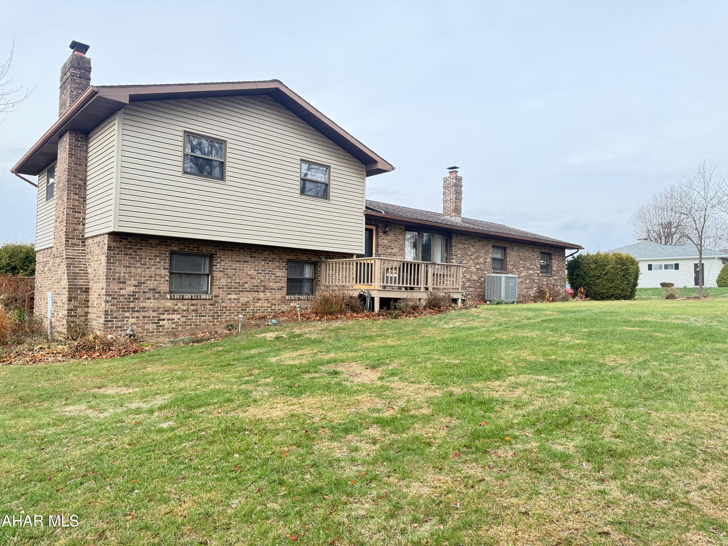 Discover the best of comfortable country living in this tri-level home, nestled within the beautiful, highly sought-after area of Martinsburg. This thoughtfully designed residence offers three levels of functional living space, perfect for families and entertaining alike.
The main level features a bright and inviting atmosphere with a seamless flow between the living room, dining area, and a well-appointed kitchen. Descend a few steps to the spacious lower level, offering a cozy family room with a large Brick Fireplace, recreation area, or a private home office. Also on this level, you will find the convenience of a half bath, laundry area, and an exit to the back yard. The upper level hosts the serene private quarters, including 3 comfortable bedrooms and a full bath, ensuring peace and quiet. Also, the home offers a wonderful sunroom with sliding doors off of the dining room area that overlooks the swimming pool and the large back yard.
Step outside to enjoy the expansive surroundings and the fresh country air. The property provides a perfect blend of indoor comfort and outdoor opportunity. Located in an exceptional neighborhood renowned for its scenic beauty and community feel, you're just minutes from local amenities while enjoying the peace of a rural setting.
This home is a rare find in a premier location. Schedule your private showing today and experience the charm of Martinsburg living!