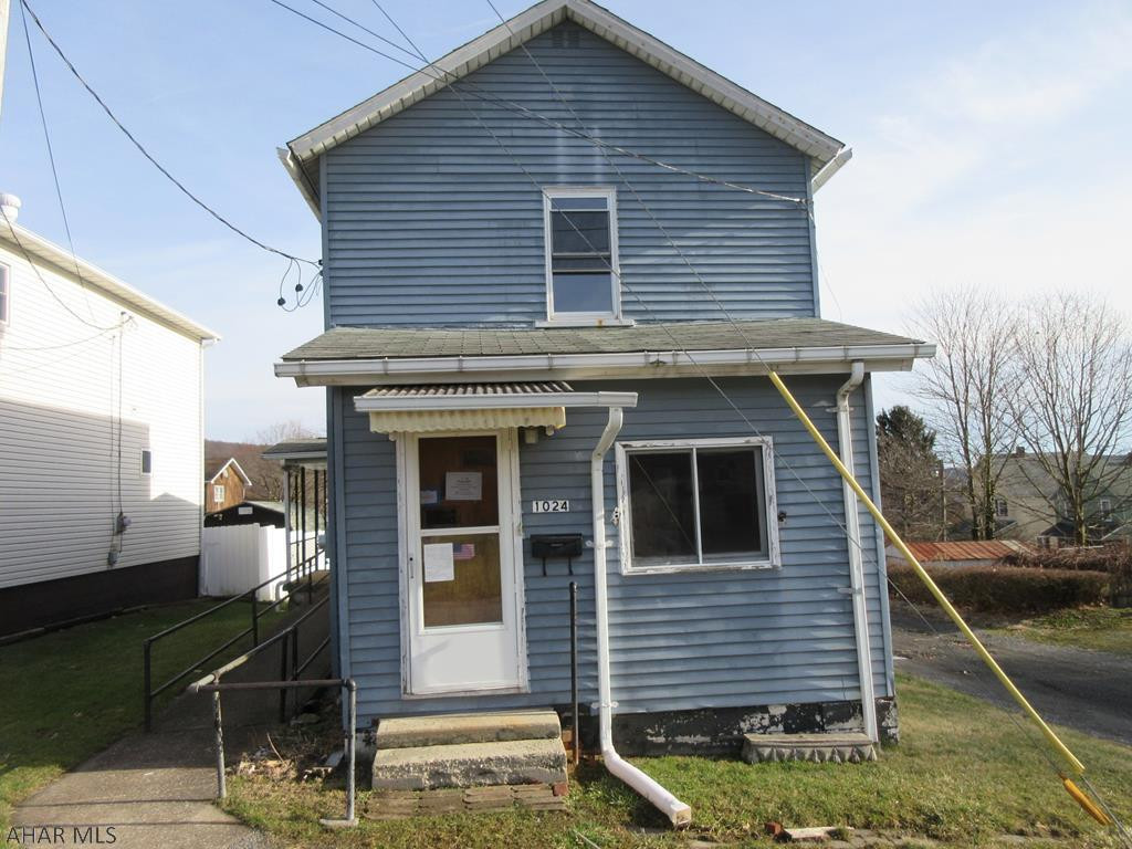 Nanty Glo 2 story home. Needs some TLC, but could be perfect for investors or handypersons. Nice sized living room, formal dining room and kitchen with first floor laundry. Nice enclosed front porch and covered side porch with ramp. Storage shed and more. Check it out!