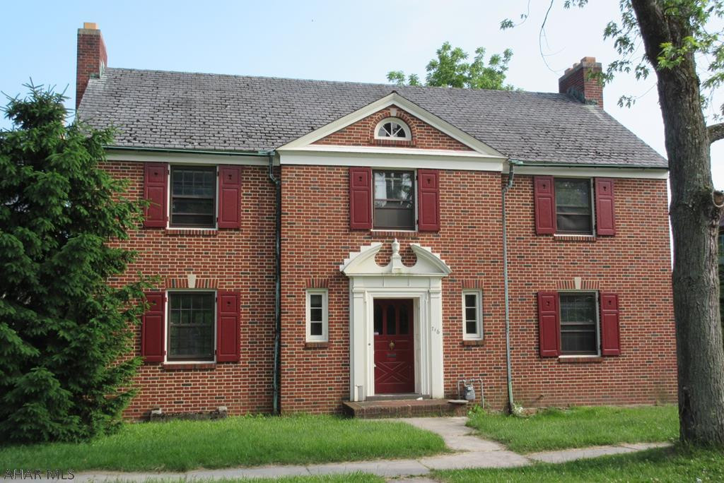 Location, Location! This sturdy built brick home in the heart of the borough needs some love to get it back to it's loving self. This 4 bedroom, 2 bath home with hardwood floors throughout is waiting for the next family to occupy it. This home has been in the same family since being built and is as solid as they come. Just needs some modern updating. Has a large fenced in yard with a great back porch. The brickwork is top notch and so is the woodwork inside. A semi-attached 1 car garage but plenty of space outback to build your own custom garage. The lot is almost a quarter acre at 60 foot frontage by 170 feet in depth. This is an Estate trust sale. Being sold as is with the Trust not fixing anything, due your due diligence before making offer Please call or text for your personal showing.
