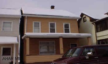 2 1/2 Story Aluminum Sided Great starter home or investment being sold "AS IS"