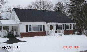 Must see!  Professionally decorated.  Custom window treatments.  Kitchen with appliances & ceramic tile.  Furnace, AC, roof and 200 amp breaker box all new in 2006.  Hardwood floors in LR & Brs Laundry chute in both bathrooms.  Above ground pool.