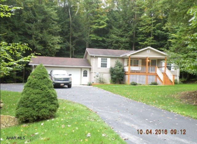 Don't miss this one! Nestled in a quiet setting this doublewide offers 3 BR's, 2 full baths, All appliances included, central air, . Full basement- partially finished. Great 2 car garage, Black top drive way, manicured lawn. 2 lots = 1 acre. Enjoy watching  the wildlife from the front porch or the back deck while barbecuing with friends