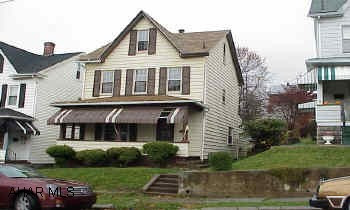 Lots of potential.  Newer windows, large rooms.  Above ground pool.