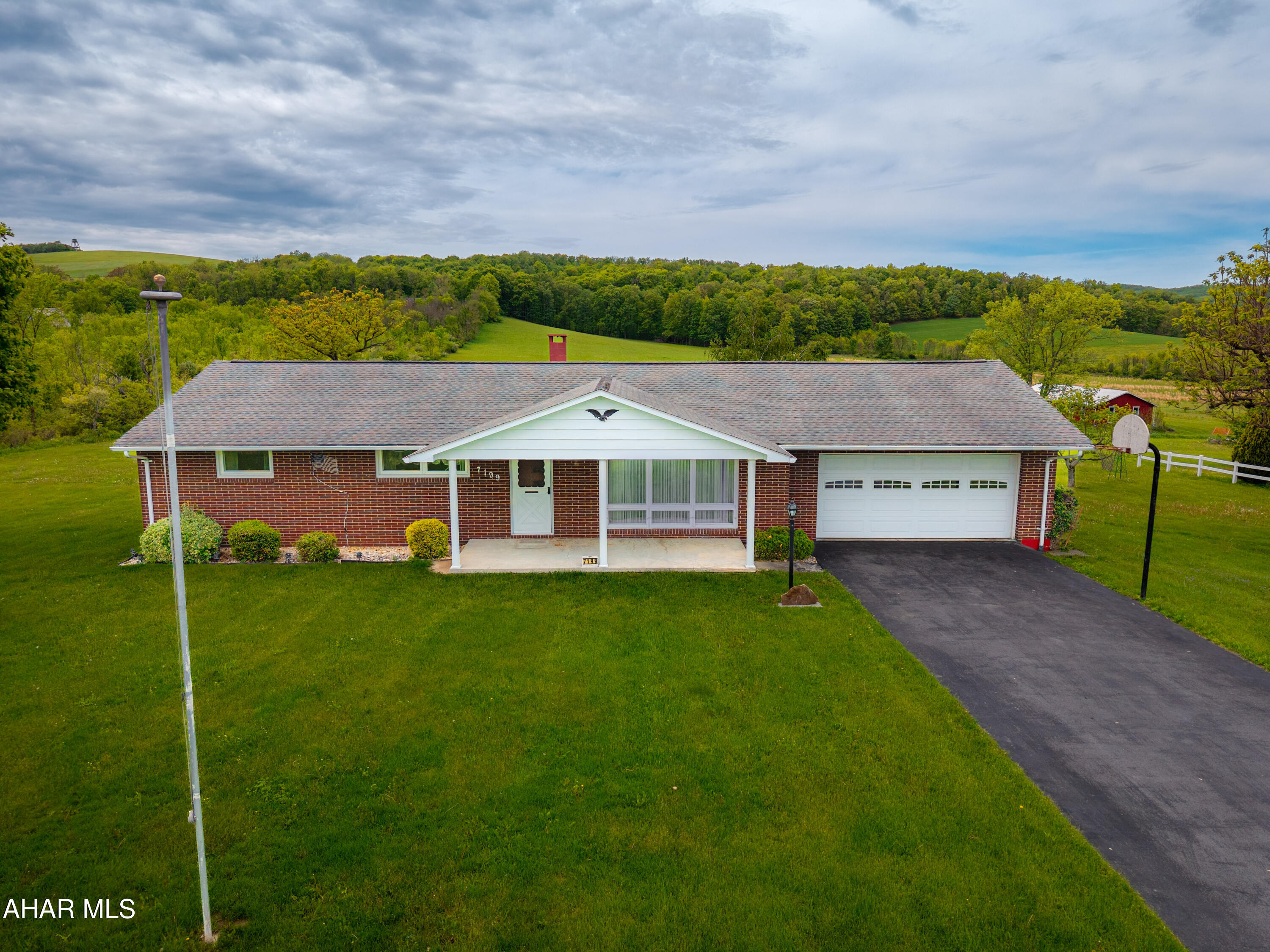 Welcome to this solid 3 bedroom, 1.5 bath brick ranch home located in the quiet town of Alum Bank, within the Chestnut Ridge School District. Set in a country-style setting yet conveniently in town, this home offers the best of both worlds. Inside, you'll find hardwood floors under the existing carpet, ready to be uncovered and brought back to life. The main level offers a comfortable layout with plenty of natural light, and the attached garage adds both convenience and extra storage space.

Step outside to enjoy a private backyard—ideal for gardening, relaxing, or hosting get-togethers. Whether you're looking for your first home, downsizing, or investing in a property with long-term potential, this one has a lot to offer. With a little updating, it could shine even brighter.

Don't miss the opportunity to make this Alum Bank gem your own!