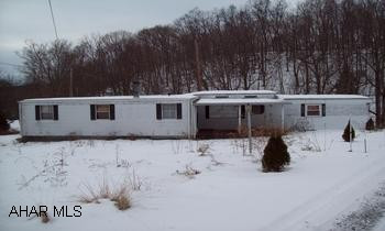Older, single wide trailer w/ addition, outbuilding and 2 car garage. Older, single wide trailer w/ addition, outbuilding and a 2 car garage.