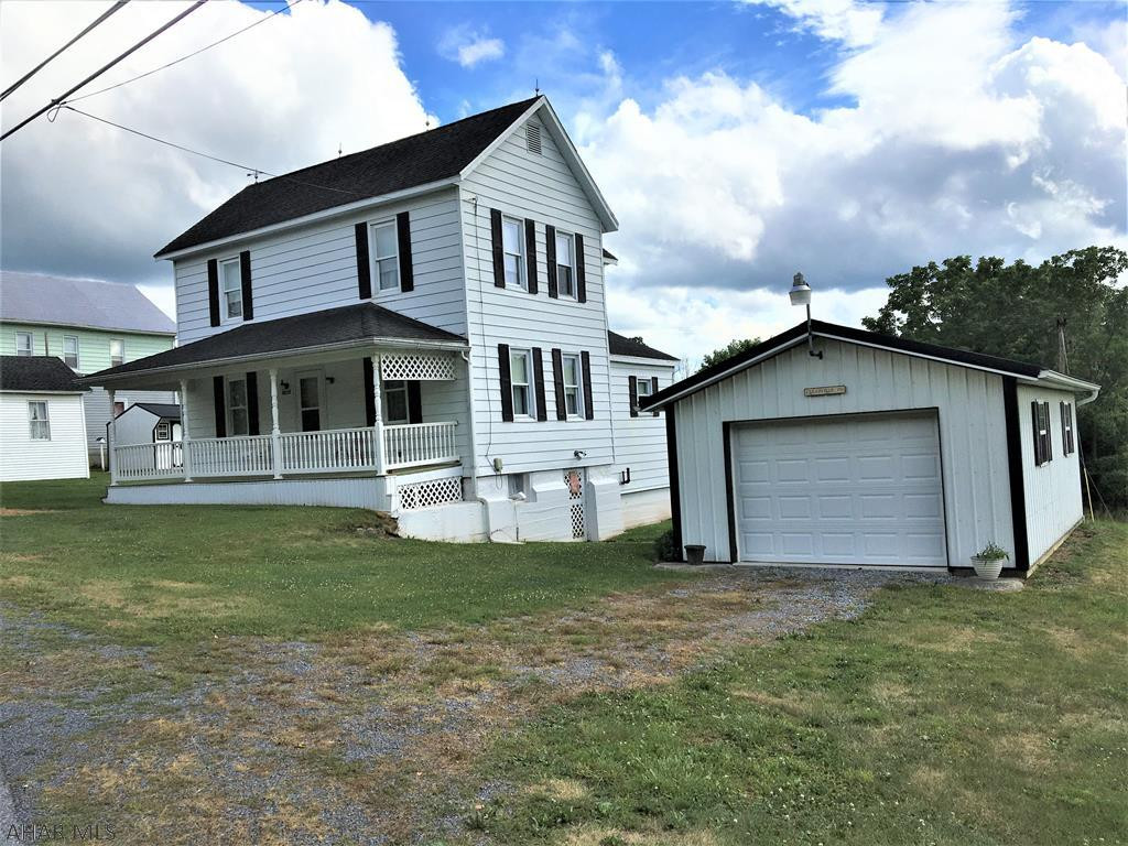 This two story home was always full of love and laughter with many afternoons and evenings spent sitting on the covered front porch. Home has been very well kept. Lot is .667 acre with gardening space and has a detached garage, 2 smaller sheds and a larger outbuilding that could have multiple uses. Eat in Kitchen with appliances included. Full bath is on main level. Three bedrooms are on the second floor, full walk up unfinished attic for storage. Take a tour and make this home yours.