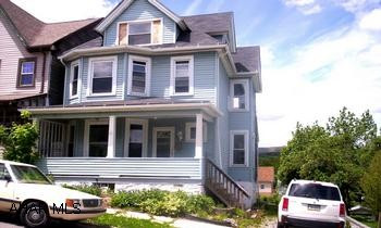 2 1/2 sty, vinyl sided, garage. 2 1/2 story vinyl sided home, comp shingle roof, replacement windows, 1.5 baths, detached garage, 100 AMP electric.  Needs paint and floor coverings.
