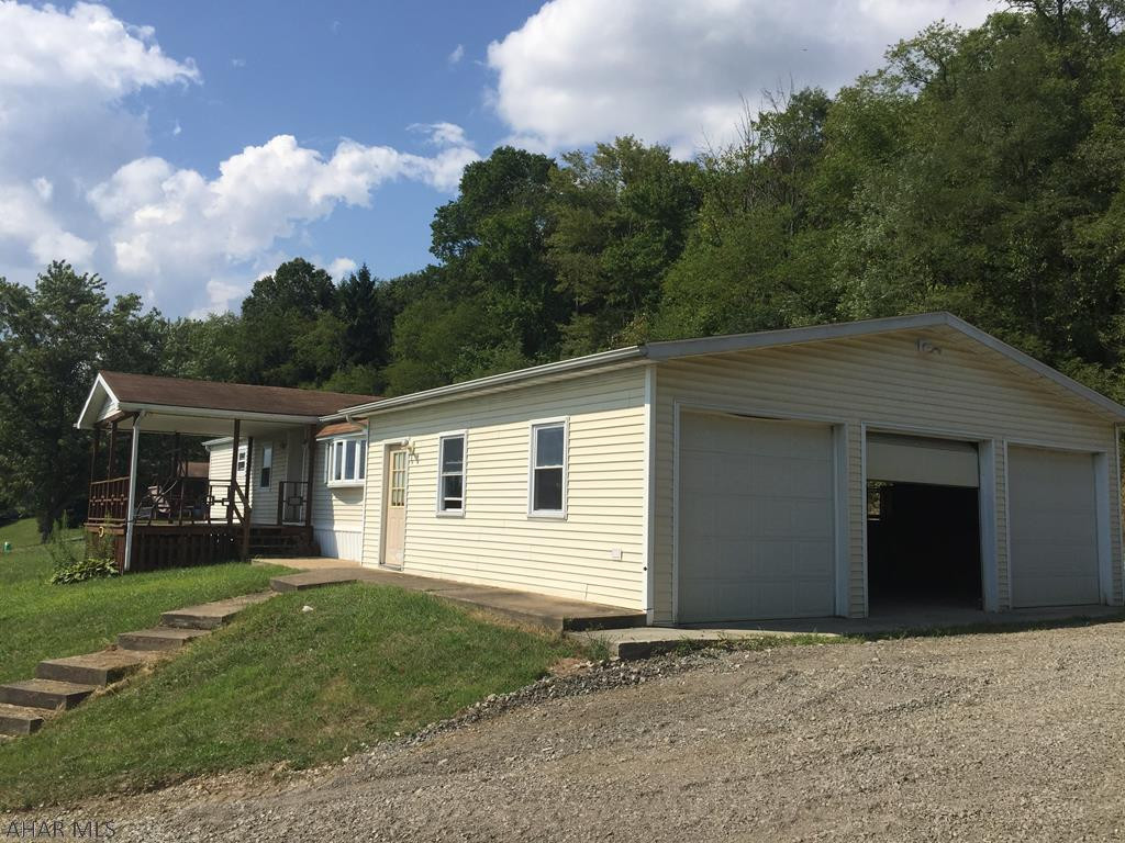 Charming home in a quite setting.  Large 3 car garage.  Hot tub.  Ceramic tile and more.  Expect to replace or repair septic.  Call today to make an appointment.  The real estate agent listing this home is also the seller.