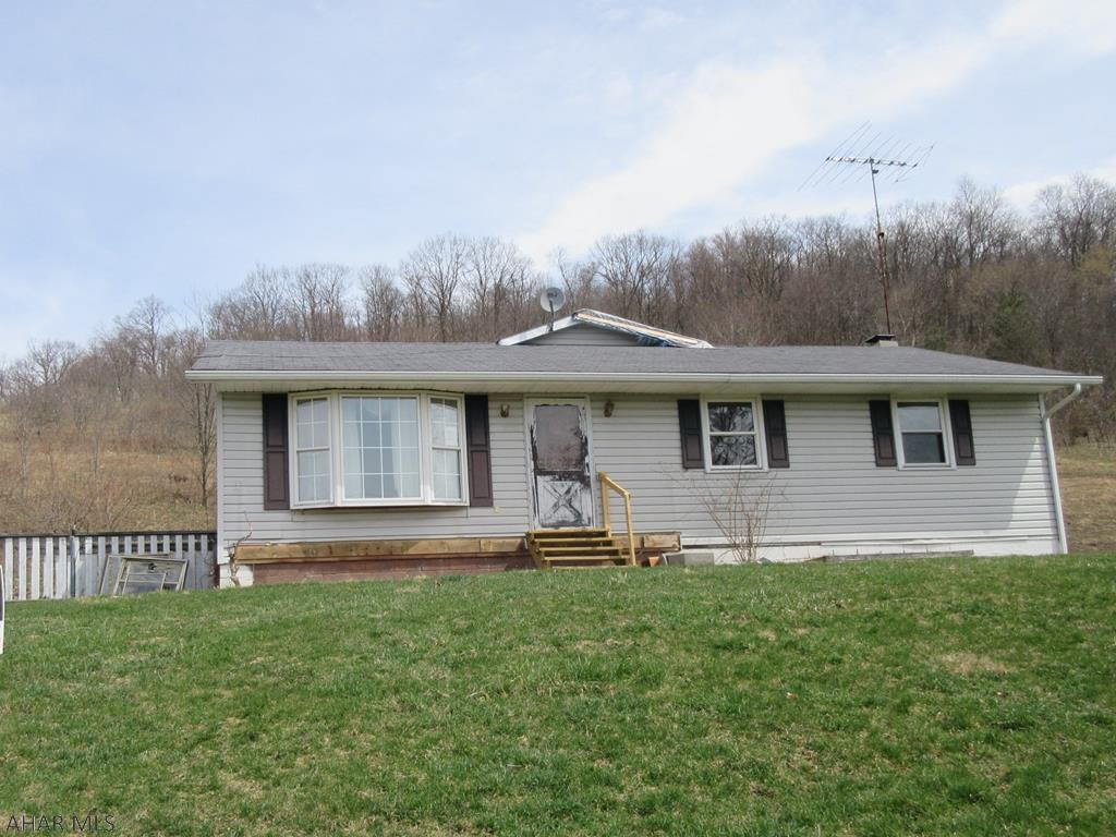 Patton area 1 story home on large 2.6 acre lot. Large open kitchen with island, dining area and vaulted ceiling, Living room and 3 bedrooms. Basement was finished at one time, so basics are there. Needs TLC, but loads of possibilities for handy persons everywhere. AS-IS sale. Seller will make no repairs.