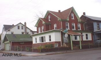 Extra large home was former physician's office & residence, fromt & side proch closed in, which served as a waiting room area, hardwood floors, and court yard. Extra large home was former physician's office & residence, front & side porch closed in, which served as a waiting room area, hardwood floors and court yard.