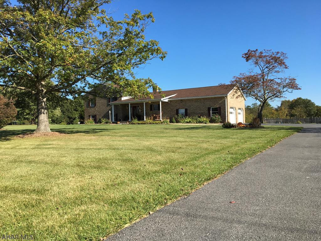 Location, Location, Location this Multi Level Brick Home has it all! One mile from Rt 70 comes out at the Amaranth Exit close to Md line and Rt 30 and Pa turnpike going the other direction. Beautiful yard and landscaping , bountiful garden, strawberry patch and white and blue grape arbors. Front porch with mountain views and rear patio looks out to 36X18 inground pool, surrounded by wood fence. Family room, Office, Bath, Laundry room on lower level. Foyer, Kitchen, Dining Area, Living Room and Two Car Garage on main level. Three Bedrooms and Two Baths on upper level. Heat pump and central air, plus a wood stove for added warmth. Kitchen appliances and window treatments included. Take a look at this superb home on 2.66 acres it is everything you could want and more!