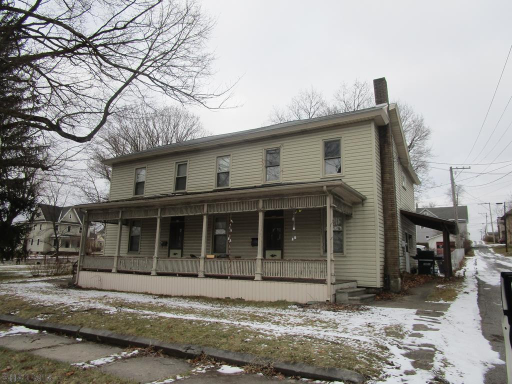 Very nice double house used as a rental. Rent is 550 per unit - mo to mo lease. One side vacant with seller not trying to rent. One unit is 2 bedrooms and the other 3 brs. Separate furnaces, electric and water/sewer. Units appear in good condition. Roof in process of being removed on garage at rear of lot.