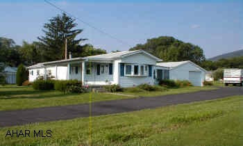 6 years ago installed new vinyl siding, new windows, new shinglesHard wood floors under carpeting, large storage room, front porch, closed porch