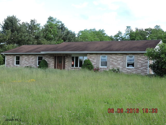 Spacious split-face block ranch on nice level 4.46 acre lot.  Needs work but price reflects as is sale.  Here's your opportunity to fix up a super home.  Cash buyers preferred.  House will not qualify for most loans.  Property must be listed for a minimum of 5 days before any offers is negotiated or accepted.  Neighbor has a 40' right of way on western side of property to access their property in rear.