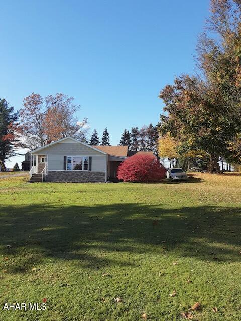 Vinyl sided rancher on approximately 0.6 acre lot. This home, in Chest Springs, features a nice kitchen, large living room, dining room, laundry, two bedrooms, 1.75 baths and a summer kitchen. Possible 3rd bedroom. Large mostly level lot across from the local ballfield.  Very nice house, no basement.