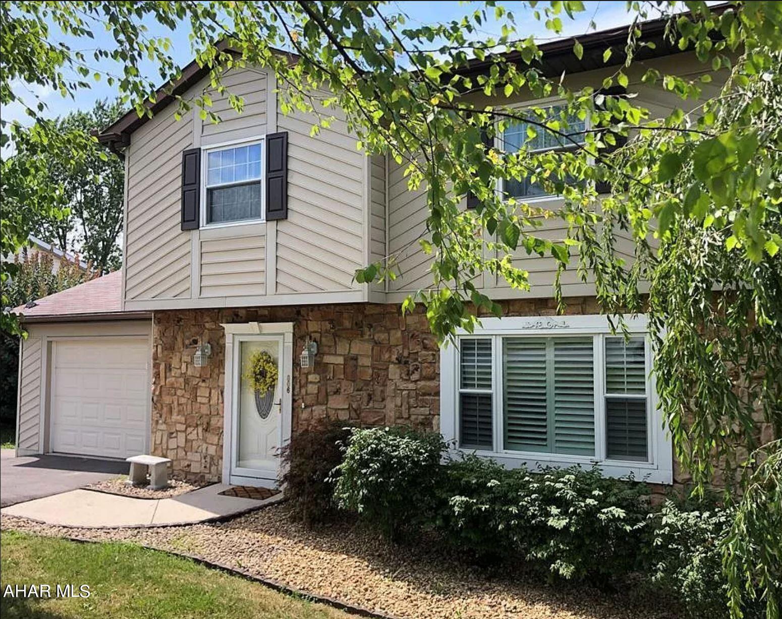 Don't miss this opportunity to reside in Penn Farms and Hollidaysburg school district!  You can move right into this lovely 4 bedroom home that is larger than it appears and has plenty of updates and features to excite.  

The main level has an open layout for the kitchen, living room and dining room areas, allowing for plenty of natural light and making it ideal for entertaining and accessibility.  Upon entering, you'll take in the fully renovated kitchen which is a chef's delight.  It features granite counters, slow-close cabinets and drawers, stainless appliances, back splash and light fixtures to accentuate the huge granite island.  The dining area provides access to the large covered deck with skylight, ideal for large cookouts or just relaxing in the shade. The living and dining areas have built in blinds.   The main level is completed with access to the finished basement, a mud room area with additional cabinets, updated powder room, and one of the garages. 
  
The second story has 4 bedrooms and 2 full baths.  The master bathroom is also fully remodeled and the walk-in closet has built ins for extra storage.  All bedrooms come have ceiling fan light fixtures.

The finished basement makes for a great family room or recreation area and boasts a gas fireplace with mantle.  Walk out to the concrete patio and fenced back yard.  The whole home has upgraded 200 amp electrical and there is an outside breaker box with a 220 volt connect that could be used to wire a hot-tub!  The backyard also has a shed with electric.  Off of the finished basement is a large utility room with laundry, storage and access to the second garage.  The second garage connects to the spacious, flat, back driveway area.