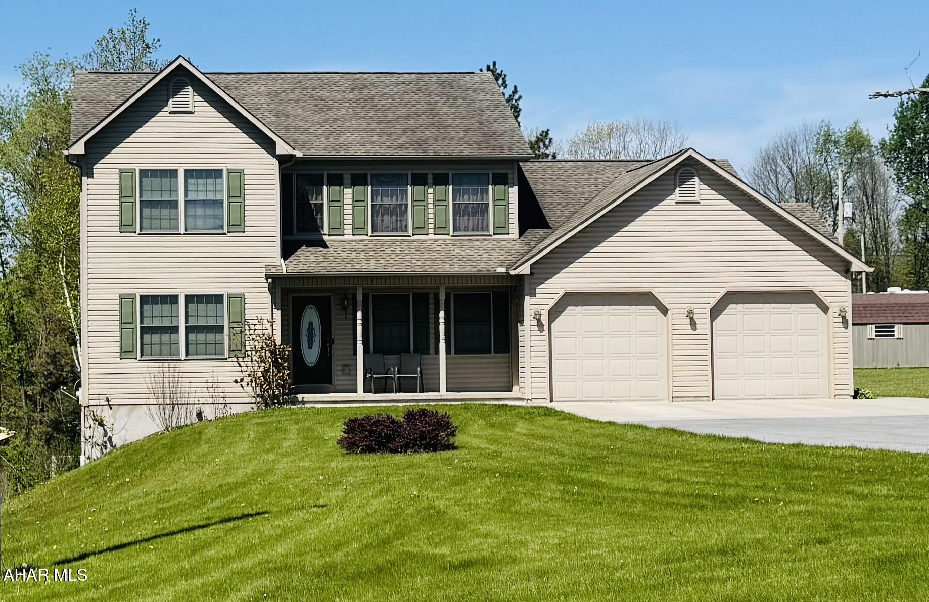 Situated on 1.1 acres, this spacious 5- bedroom, 4-bath home offers comfort, functionality, and room to entertain both inside and out. The inviting open floor plan features a large living room with an electric fireplace, flowing seamlessly into the formal dining room highlighted by oversized windows that fill the space with natural sunlight. The well-appointed kitchen comes complete with all appliances included, while the convenient first-floor laundry adds everyday ease. The first-floor primary suite offers a private retreat with a large bath featuring a soaking tub. A lower- level bedroom with a 3/4 bath provides excellent space for guests or extended family. The finished lower level also includes a second large entertainment room, perfect foe gatherings, recreation, or a media area. Outdoor living is exceptional with a two-tier deck, including an upper 12x32 deck and a lower 16x24 deck overlooking the property. Additional features include central air conditioning and an efficient heat pump heating system with electric strip backup. Furniture is negotiable, making this home move-in ready with flexible options for the new owner.