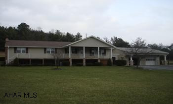 Ranch home with three bedrooms, 1 1/2 baths, kitchen knook area, dining room, large living room with gas fireplace, two car garage,in  ground pool, hot tub, family room in basement with gas fireplace and bar. Features first floor laundry.   On 4.062 Ac. Ranchhome with three bedrooms, 1 1/2 baths, kitchen knook area, dining room, large living room with gas fireplace, two car garage,inground pool, hot tub, family room in basement with gas fireplace and bar.  First floor laundry room, heat pump, central air.  Plenty of room to spread out on 4.062 Acres and even a stream on property.   Heat is oil hot air, electric, and heat pump.