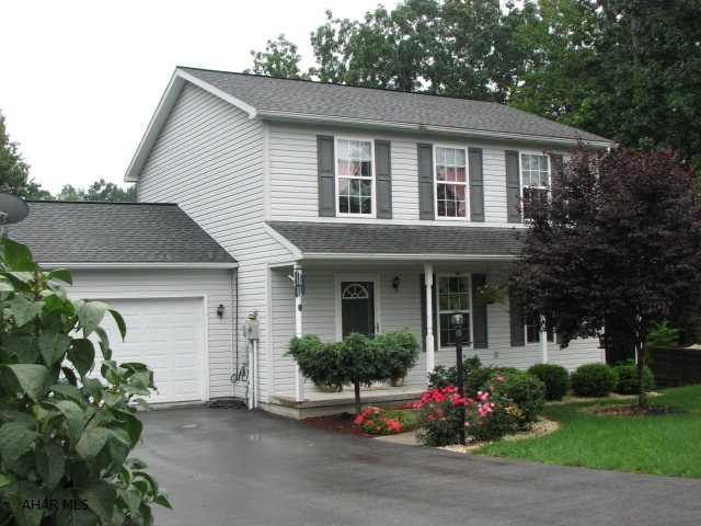 Sitting on over an acre of ground, this great house is move in ready. The inside offers beautiful hardwood floors a fun south western decor and great color choices.  The laundry is on the first floor, dining room walks onto the deck for a great view and the spacious master bedroom with walk in closet are just some of the finer points of this home.  The unfinished basement with walk out door leaves a great opportunity to add your own finishing touches. The spacious side yard has plenty of room to run and the rear (approximately 250 feet into woods) has it own space for exploring or just enjoying the view!