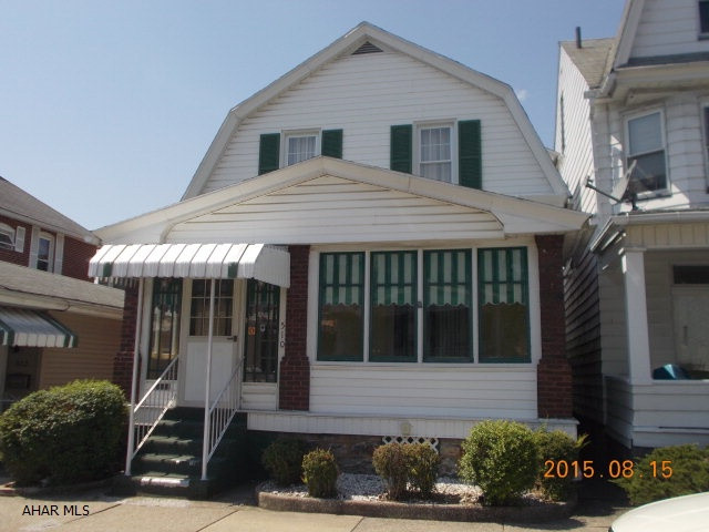 Move in Ready! This well maintained home has a ton of updates. A large living room, dining room and kitchen are accented by enclosed front and rear porches. New flooring in the roomy kitchen.  Upstairs you will find new carpet, 2 nice size bedrooms and a den that could be used as a small bedroom. The bathroom includes updates to the plumbing, floor and sink. A roomy 1 car garage with a brand new automatic door is at the back of the level lot. Take a look and you won't be disappointed!