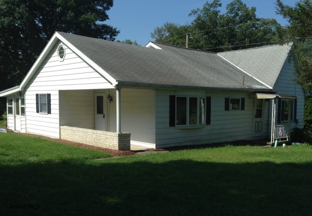 3 bedroom bright and sunny ranch home located on 3 acres with 2 car garage and an additional 1 car garage used as a workshop. The home has been beautifully maintained over the years. Many lovely updates include remodeled kitchen, bathroom, addition, sunroom, main floor laundry room and windows. The kitchen offers tons of storage and counter space and is graced by solid wood cabinets. Outside will not disappoint as the woods provide lots of space to hunt or just enjoy nature. The oversized 2 car garage has tons of storage space available while the additional 1 car workshop provides extra work space. The basement provides tons of storage and an extra shower.