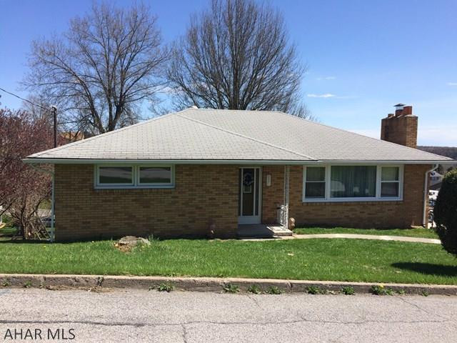 This solid well maintained 3 bedrooms, 2 bath brick ranch home is located in Ebensburg borough. The updated eat-in kitchen has plenty of cabinet/counter space. Large living room features a fireplace. Off of the foyer is a room currently used as an office. The 3 spacious bedrooms have plenty of closet space. Basement has a large room currently used as a bedroom, a shop area, storage rooms and a large open bonus area. New garage door, blown insulation, windows, back porch roof, gutters and down spouts. Second  garage is very large could be used for car or boat. Enjoy the back covered porch this summer while entertaining family and friends. Room sizes approx.