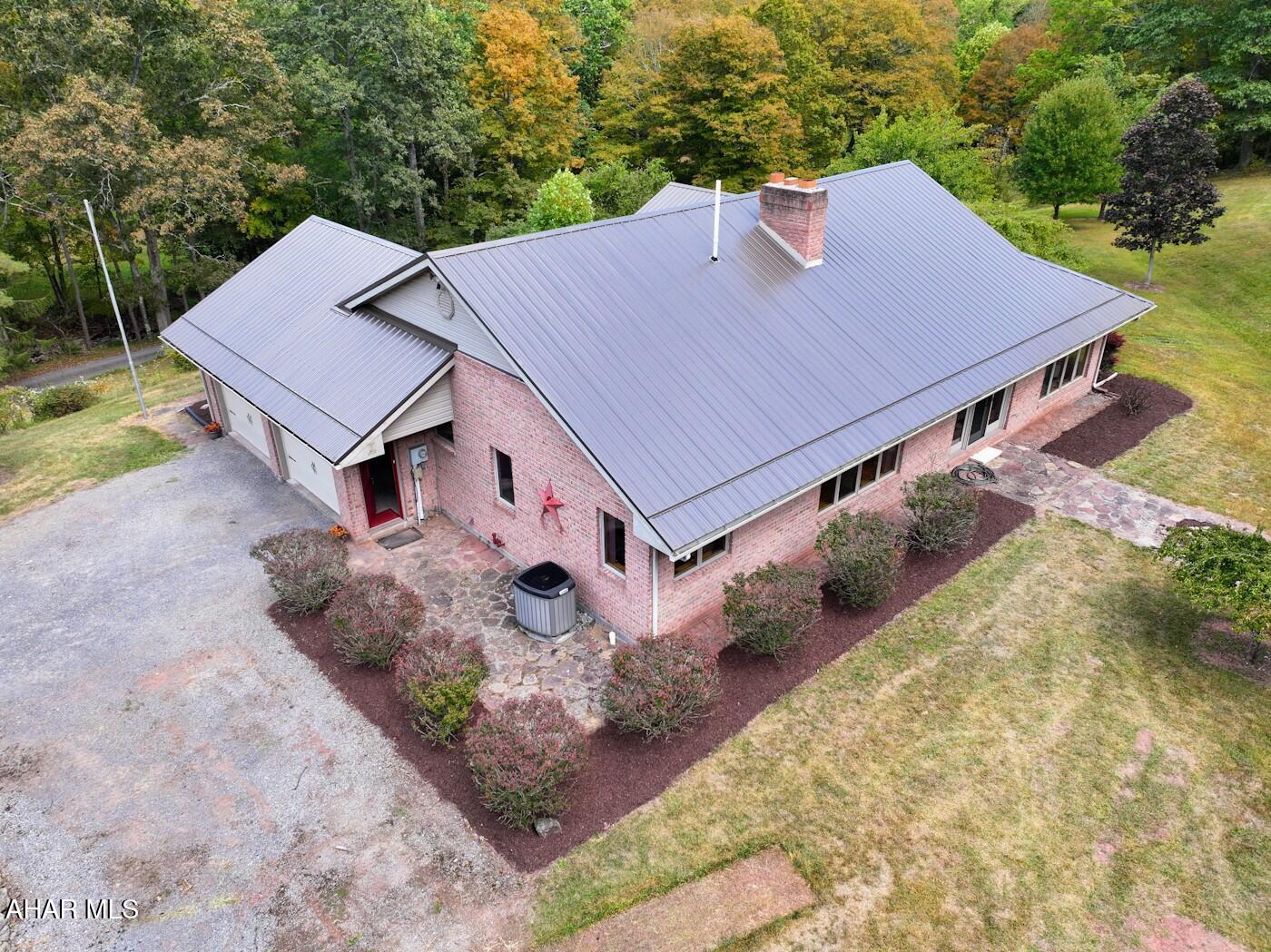 NEW PRICE!
Looking for Peace and Tranquility surrounded by the sounds of wildlife and nature, this full BRICK ranch home has all that and more. If walls could talk , you would hear all the amazing stories of love and laughter shared in this home. Built and only lived in by the original owners, who were hands on making sure only the best materials were used and all woodwork was custom made. Nature views can be seen out of every window. Located very close to State game lands. Home has a brand new roof and new garage doors. Garage is an oversized 2 car attached with a 1/2 bath. Unfinished basement just waiting for you to personalize. Roomy living room , with brick fireplace. All season room waiting for relaxing enjoyment. Primary bedroom with walk-in closet and large bathroom. Laundry hook-up is located on main level. 2 extra bedrooms and full bath on the other side of the house. Nice size kitchen with eat in breakfast area. Private well and septic, heat pump with oil back up and central air, sitting on 2 acres. Come take a tour of this home which just needs the right person to fill its walls with new memories!