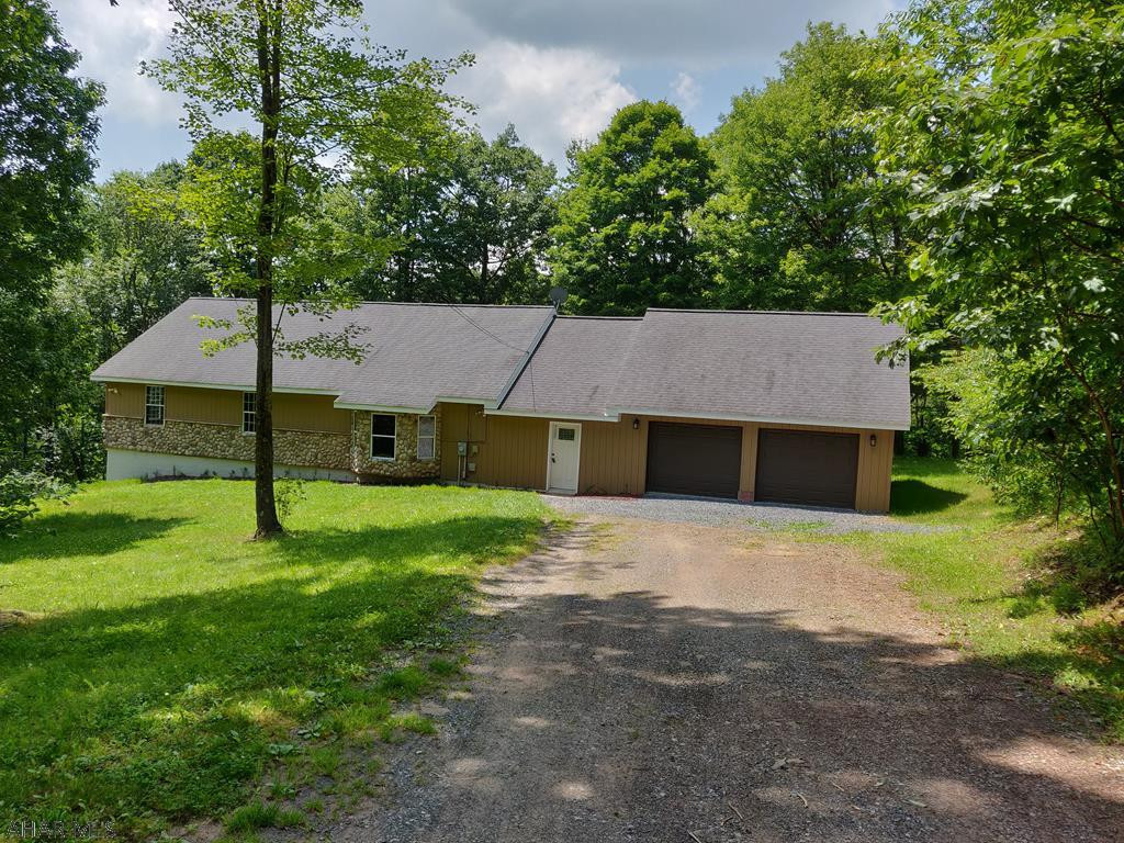 Escape to your Secluded Haven in the Woods near Blue Knob Ski Resort. Private 4 BR 2 Bath 2 Car Garage Home on over 8 Acres. Woods with some open areas. Wildlife abounds. An excellent Residence or Vacation Home. Freshly Painted, New Carpet, Large Deck for Entertaining, Master Suite, Finished Basement, Roomy Garage with Large Walk Up Storage Level above it. Space for all the Toys. Hunter's Paradise. Property has a spot for RV parking. Home is close to the Bedford / Blair County Line. Located about 2 Miles from Blue Knob Ski Resort. An Easy Commute to Altoona, Bedford, Ebensburg, or Johnstown. No HOA.