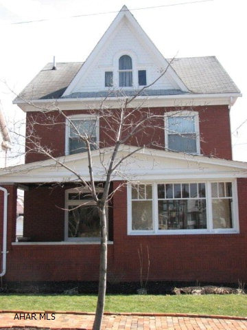 Wonderful 4 bedroom brick home with terrific charm and character.  Opens into sunroom with french doors and a grand foyer.  Beautiful original woodwork and pockets doors in formal dining room.  Lead glass windows complete the original look of the home.  Fantastic finished 3rd floor with walk-in closet.