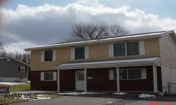 Large Raised Ranch on large flat lot. Gas & electric heat, central air, large family room, covered deck.  Realtor owned.