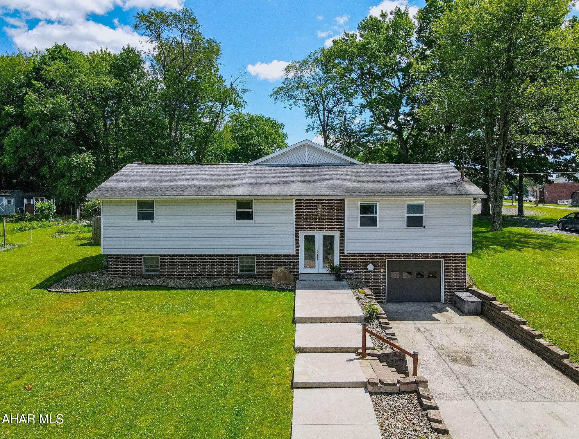 Spacious  Split-level home offering 4 bedrooms and 2.5 baths in a convenient central location! The main level features an expansive beautiful open-concept kitchen and living area, perfect for everyday living and entertaining, along with an eat-in area in the kitchen & formal dining space as well leading out to the back patio.  The finished lower level includes a functional family room, full bath, large laundry room, and abundant storage space.

Enjoy year-round comfort with hot water radiant heat supplemented by a mini-split system, plus central air conditioning in the main living area. Recent updates include a new hot water heater (2024) for added peace of mind.

You'll also find an a garage and a large fenced backyard offering plenty of space for recreation, gardening, or pets. Ideally situated just steps from Veteran's Park and super easy access to I-99, this home combines space, comfort, and convenience in a desirable location. Call for your showing today!