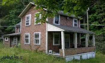 Private & secluded property w/ approx 105 acres that adjoins State Forest Lands. Land is mostly wooded. Very old 2-story house on property that needs many repairs or torn down for your own new cabin or home. Electric, well & septic to the current home. From Bedford take St.Rt 30 to Everett. From Everett take St.Rt. 26 South to town of Clearville. In Clearville, continue straight to a right onto Big Creek Rd. Follow for +/- 12 miles to stop sign. Make a right and continue to a right onto Crooked Run Rd. Follow to a right at the Road Kill Cafe. Follow to stop sign and make a right. Access road will be on the right after a brown two-story house. There is a gate at the property that is not locked. Follow past gate to property.