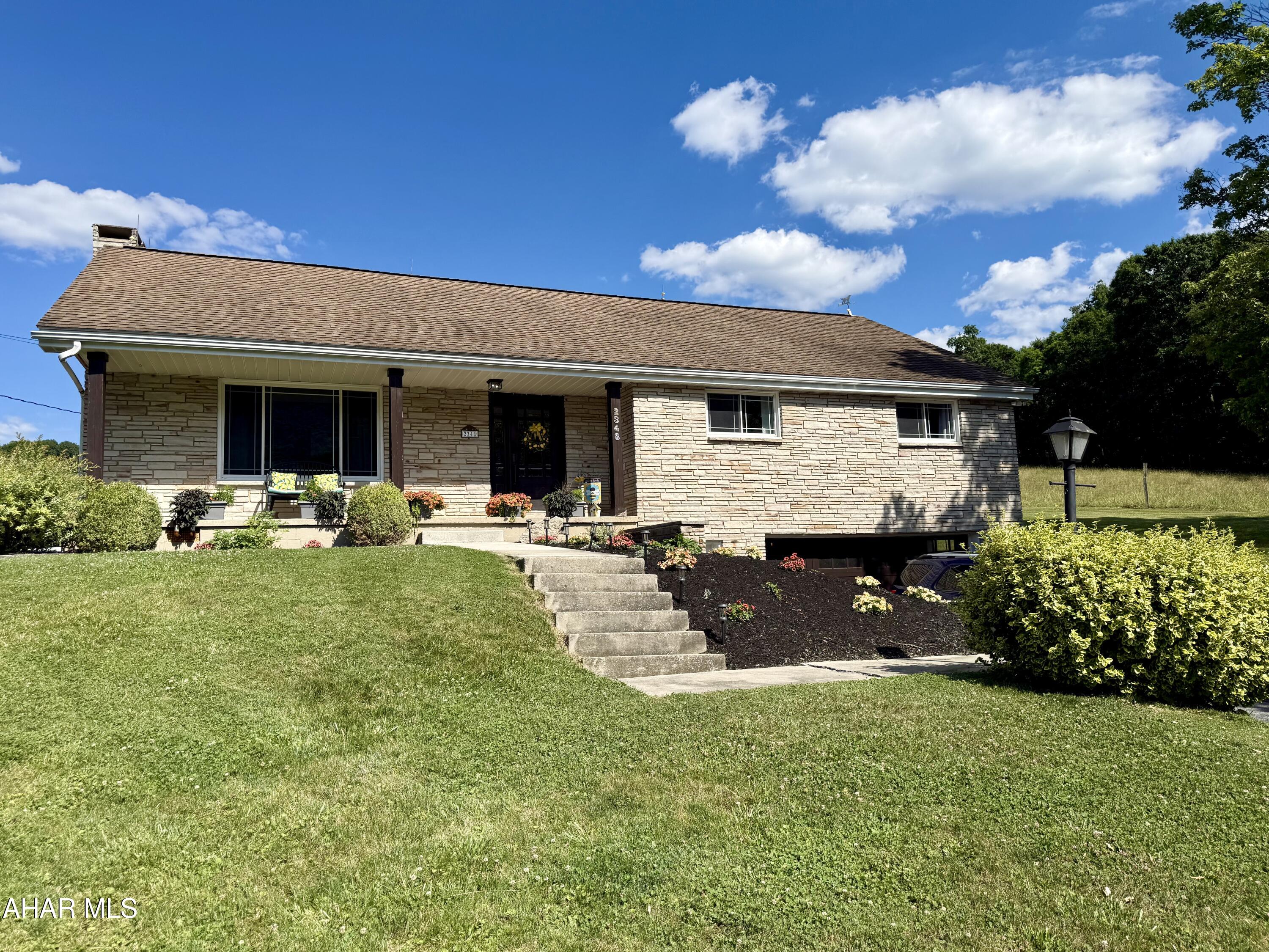 Move right into this beautifully updated 4-bedroom, 2.5-bath ranch home in Northern Bedford School District! Situated on .696 scenic acres, this spacious property offers stunning views from every window and the perfect blend of modern updates and country living.

Nearly every inch of the home has been updated, including a new furnace and a completely remodeled kitchen featuring quartz countertops within the last 2 years. The main level boasts a large living room, formal dining area, updated kitchen, and a beautiful sunroom that's perfect for enjoying the surrounding countryside.

The finished basement provides additional living space with a recreation/family room, laundry area, and a 3/4 bath. The fully remodeled attic offers incredible flexibility and could serve as additional bedrooms, a home office, hobby space, or bonus room. This level also includes an updated half bath.

Efficient heating and cooling are provided by a heat pump with central air and oil backup. A 1.5-car garage offers convenient access to the basement. Outside, enjoy the peaceful setting from the rear patio or gather around the firepit