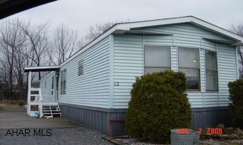 Single wide.  Lot rent $250.00 month includes water, trash, sewer, and snow removal.
