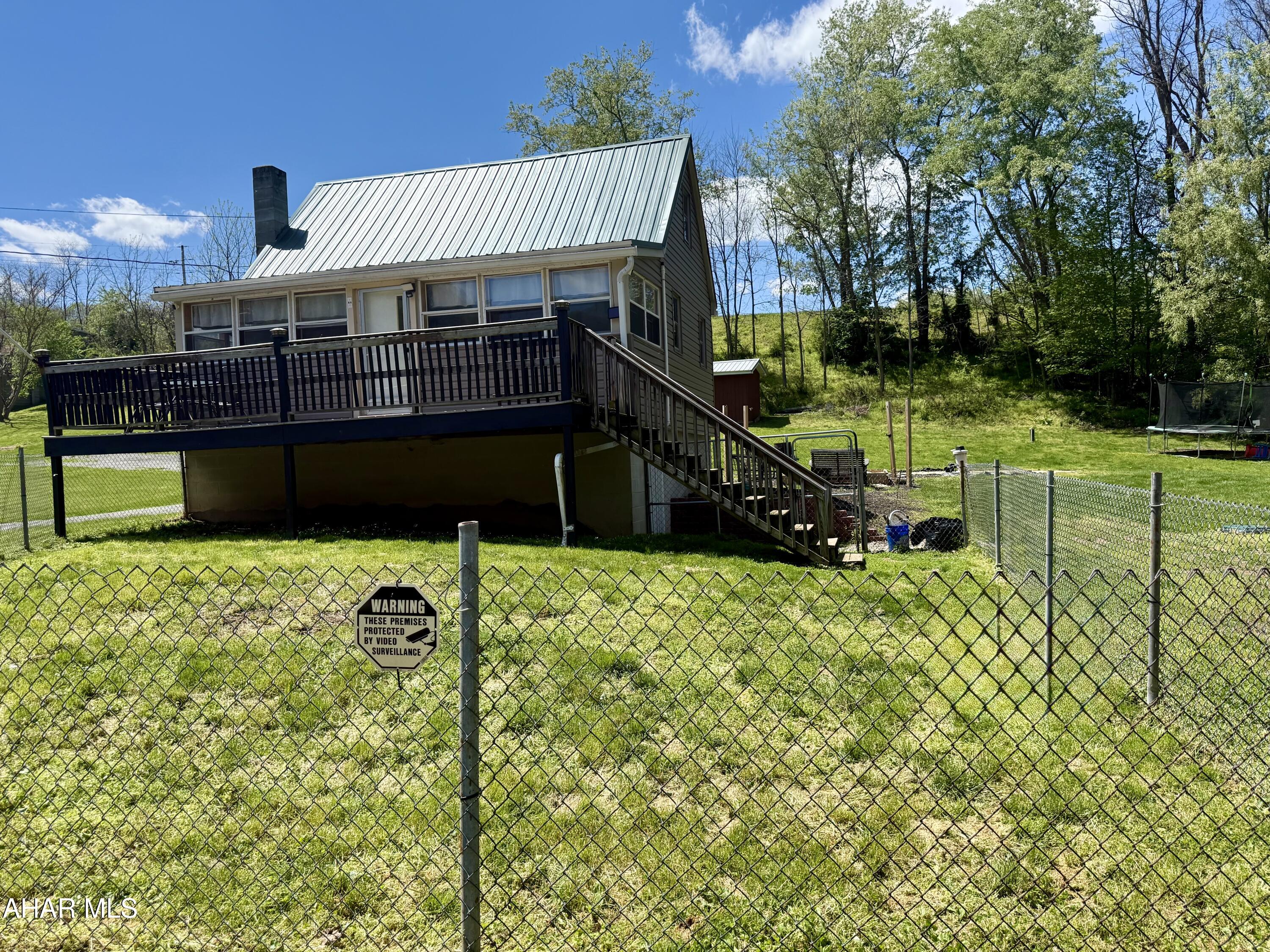 Looking for a cozy getaway or a full-time residence? Check out this home in the little community of Locust Beach (Northern Bedford SD). sitting on .424 acres, On the main floor you will find a bedroom, a full Bath, living room and a recently updated Kitchen.  The upstairs offers a versatile space that could be extra sleeping area, office, etc.  Stunning natural wood throughout the home. Full basement. Easy access to river frontage at Locust Beach. Great for fishing, kayaking etc.