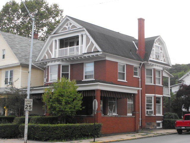 Large 3 story building has lots of potential for professional office or storefront.  Zoned Town Center Commercial permits many uses. Third floor apt rents for $400 + elec.  All natural woodwork & beautiful log cabin style hardwood floors. 8 rooms & 2 baths 1st & 2nd floor.