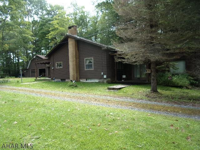 Nice one story home in Hollidaysburg School District.  2-stall horse barn - 3-car detached garage with loft.   Cozy 2 bedroom rancher with sunken Great Room addition with stone fireplace.  Large covered rear patio.  Large lot.  Laundry area in basement with shower stall.  Pellet stove insert.