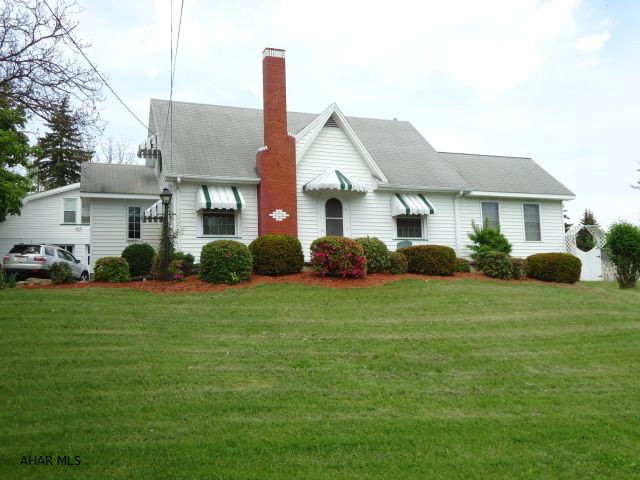 Cute house with large sunroom/familyroom, inground pool, 1st floor master suite, living room with fireplace and built-ins, 2 car garage with 1 bedroom apartment above. Apartment utilities are not separate. Currently rented @ $450.00 a month.