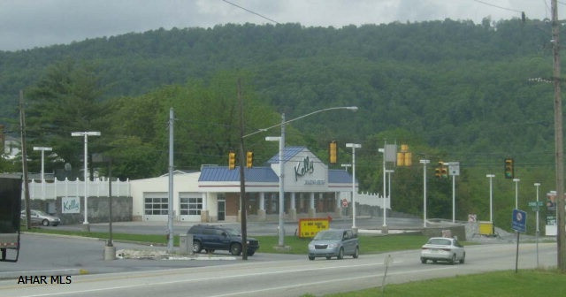 Modern 3200 sq. ft. commercial location.  Former auto dealership on 1.4 acre corner property with signal light.  Easy access, high visibility, 21,000 daily traffic count.