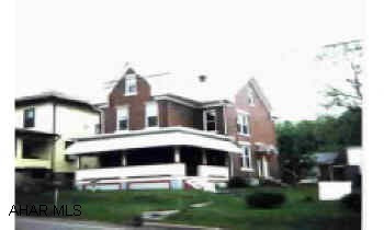 Two story brick with 3 bedrooms, central air, two car garage, new windows, large corner lot, greap potential. Commercial zoning. Two story brick with 3 bedrooms, central air, two car garage, new windows, large corner lot, greap potential. Commercial zoning.