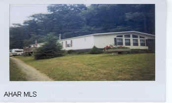 Property adjoins State Game Lands!  Won't last - 1990 lg. double wide home in excellant condition.