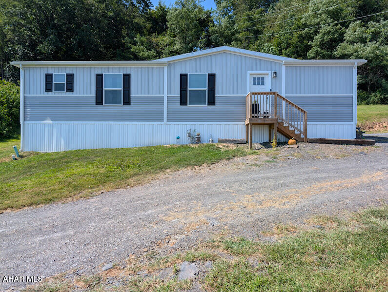 Charming Modern Living Awaits in Osterburg, PA!  Welcome home to this delightful newer double-wide oasis nestled on a sprawling 1.026 acres within the sought-after Chestnut Ridge School District. This stylish residence offers an exceptional blend of modern design and serene country living.

Step inside to discover a bright and airy open floor plan that seamlessly combines comfort and style. The spacious living area is adorned with modern finishes, creating an inviting atmosphere perfect for entertaining or cozy nights in. The chef's kitchen boasts sleek cabinetry, generous counter space, and updated appliances—ideal for hosting gatherings and showing off your culinary skills.  

With three bedrooms, including a relaxing master suite complete with an en-suite bath, you'll have ample space for privacy and relaxation. Each room is designed with natural light in mind, providing cozy spaces to unwind after a long day.

The gorgeous views of Bedford County's country side, provides endless opportunities for recreation and entertainment. Imagine hosting gatherings under the stars or simply enjoying peaceful mornings sipping coffee on your porch as you take in the scenic beauty.  Call today to schedule your private tour.  Your new home awaits.