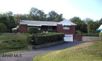 Brick home, modern kitchen, 2 fireplaces, 2 bedrooms, family room in basement.  Chair lift. Home in move in condition.  Living room with fireplace, dining room with corner cupboards, family room with fireplace.