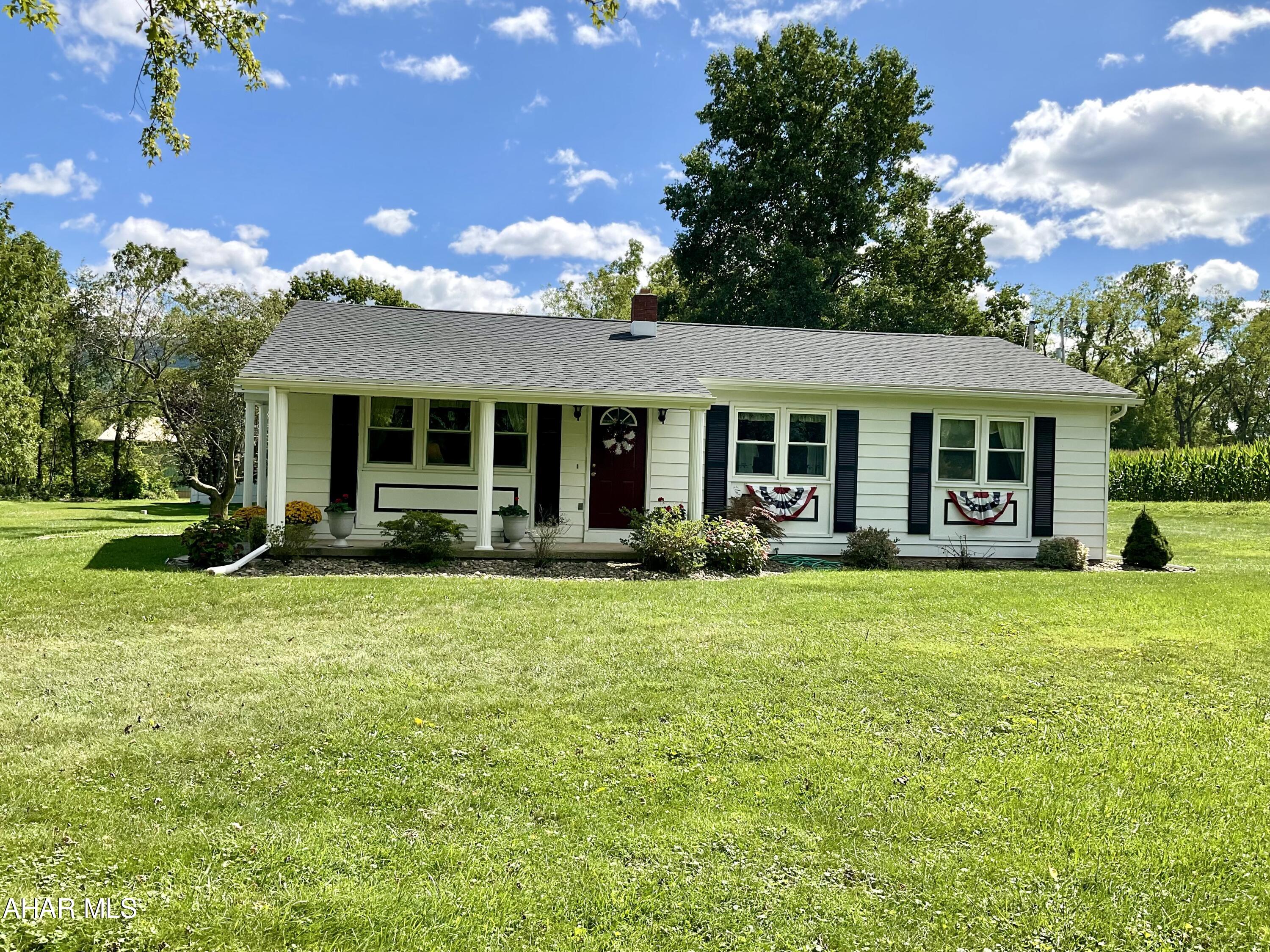 ***Meticulously Cared for SINKING VALLEY Home*** On 3.85 ACRES! Do You Want Horses, Mini Ponies, Goats, Chickens...? Here you can have them ALL. The extra lot Has it's own Well!! The Home offers 3 Bedrooms, Undated 1 1/2 Baths, Central A/C, the Modern Eat-In Kitchen boasts Solid Cherry Cabinetry with Corian Counter Tops and lovely Ceramic Tile Backsplash and Floors. A NEW ROOF was installed Aug 2024! Relax on your Covered Front Porch with you Favorite Book & Beverage. As you tour this Sweet Home take notice of the quaint finishing touches: Wainscoting, Chair Rails, Shutters on DR Windows all lend to the Charm of this Lovely Home. The Full Basement has High Ceilings and is ready for your Personal Design. Outside you will find a RETRO STYLE OUT BUILDING with the Original Sink & Stove! Make it a Private Guest House or your Personal Retreat.
THE BASEMENT HAS BEEN WATERPROOFED!! Please Schedule your Showing Soon. Owner Occupied requires a 24hr Notice to Tour.
