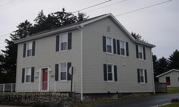 Remodeled duplex - could easily be made into a single family.  Each unit has two bedrooms, kitchen, bath, living room, plus a two car detached garage. Separate utilities.  One unit is electric heat and one unit is oil. There are two off street parking spaces.