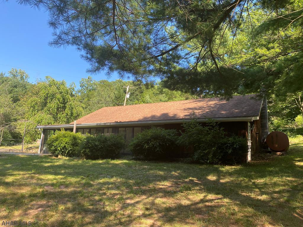 Over 11 acres near Pennsylvania State Game Lands 67 and Rothrock State Forest, with 7 miles of Lake Raystown Resort. Wooded and cleared, steep dirt road access, one story home with detached garage and mobile home, This property is eligible under the First Look Initiative which expires after 20 full days on market. No investor offers until first look period expires.  No offers regardless of buyer type will be negotiated within the first 7 days of listing.
